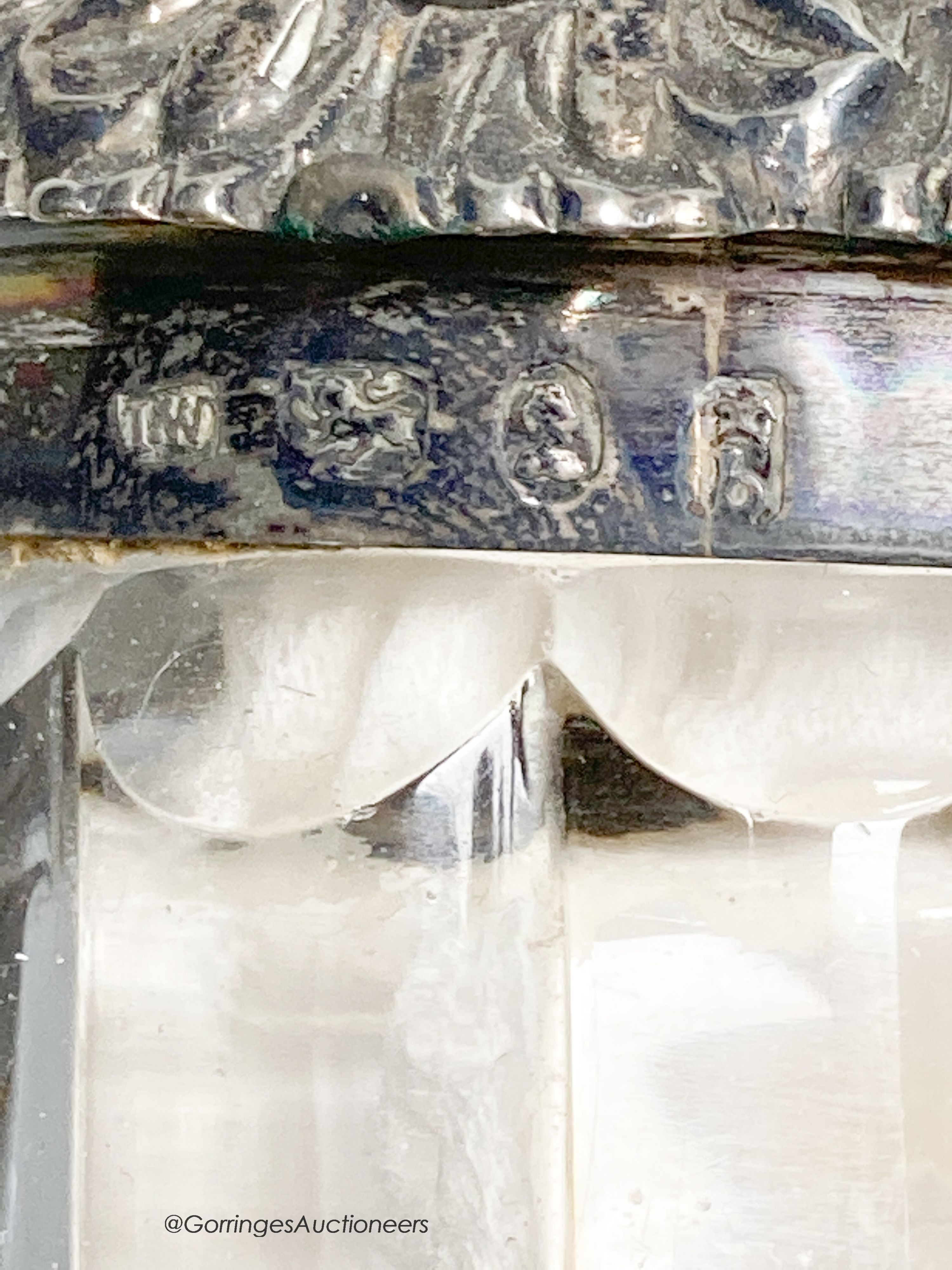 A George III silver cruet stand, by Emes & Barnard, London, 1813 and four associated cruets, two with silver mounts, 21.5cm, 13.5oz.